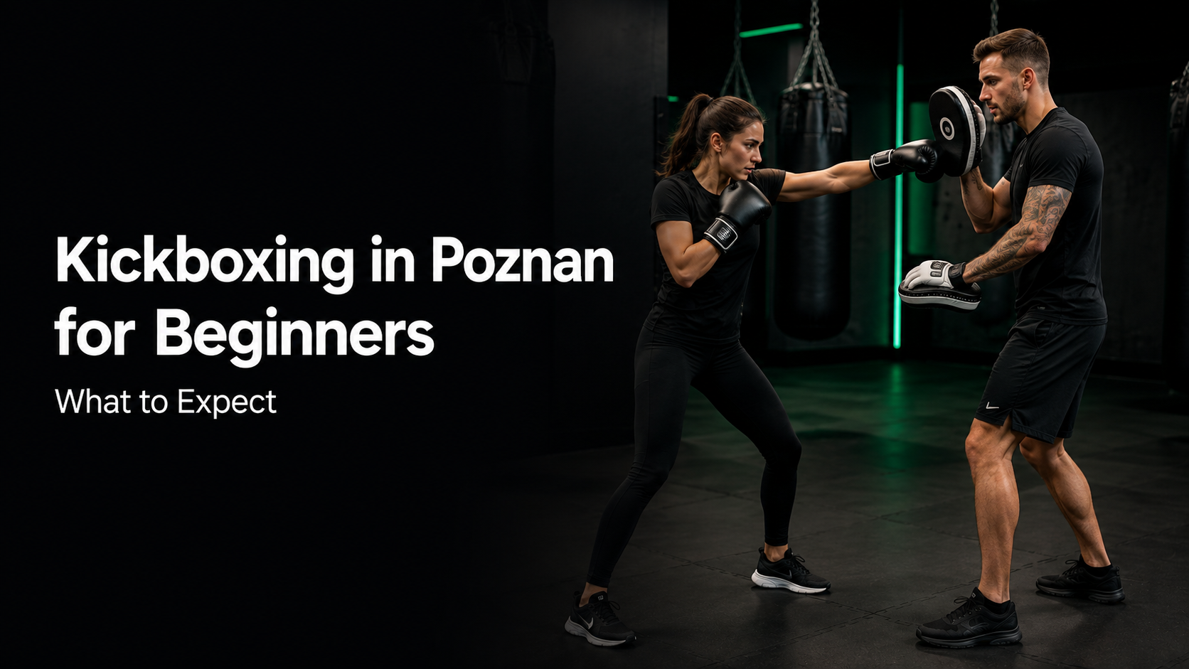 Woman learning kickboxing on focus pads with a coach in Poznan